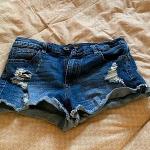 Jeans shorts with ripped detailing.